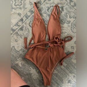 All 3 one piece bathing suits, brown- worn once, the other two only tried on